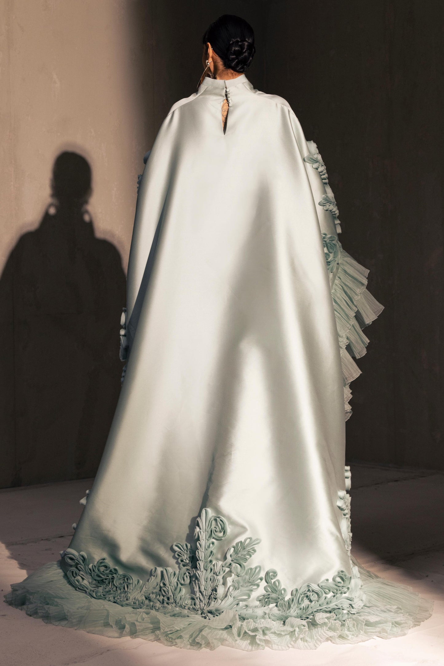 Voluminous Ruffled Cape Gown