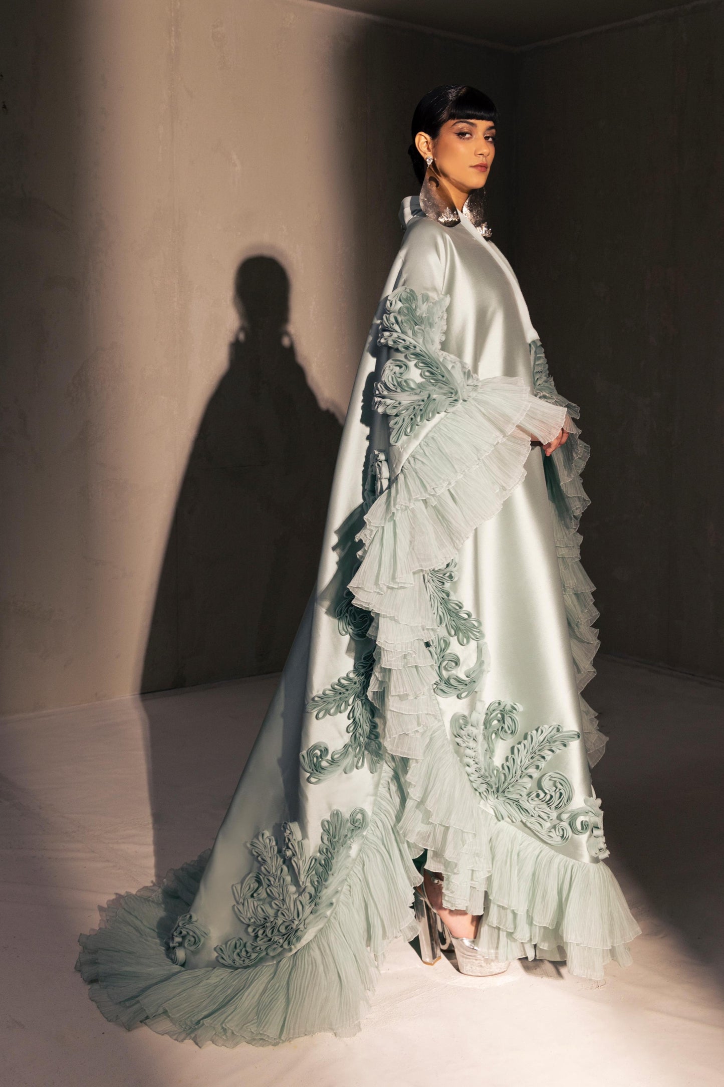 Voluminous Ruffled Cape Gown
