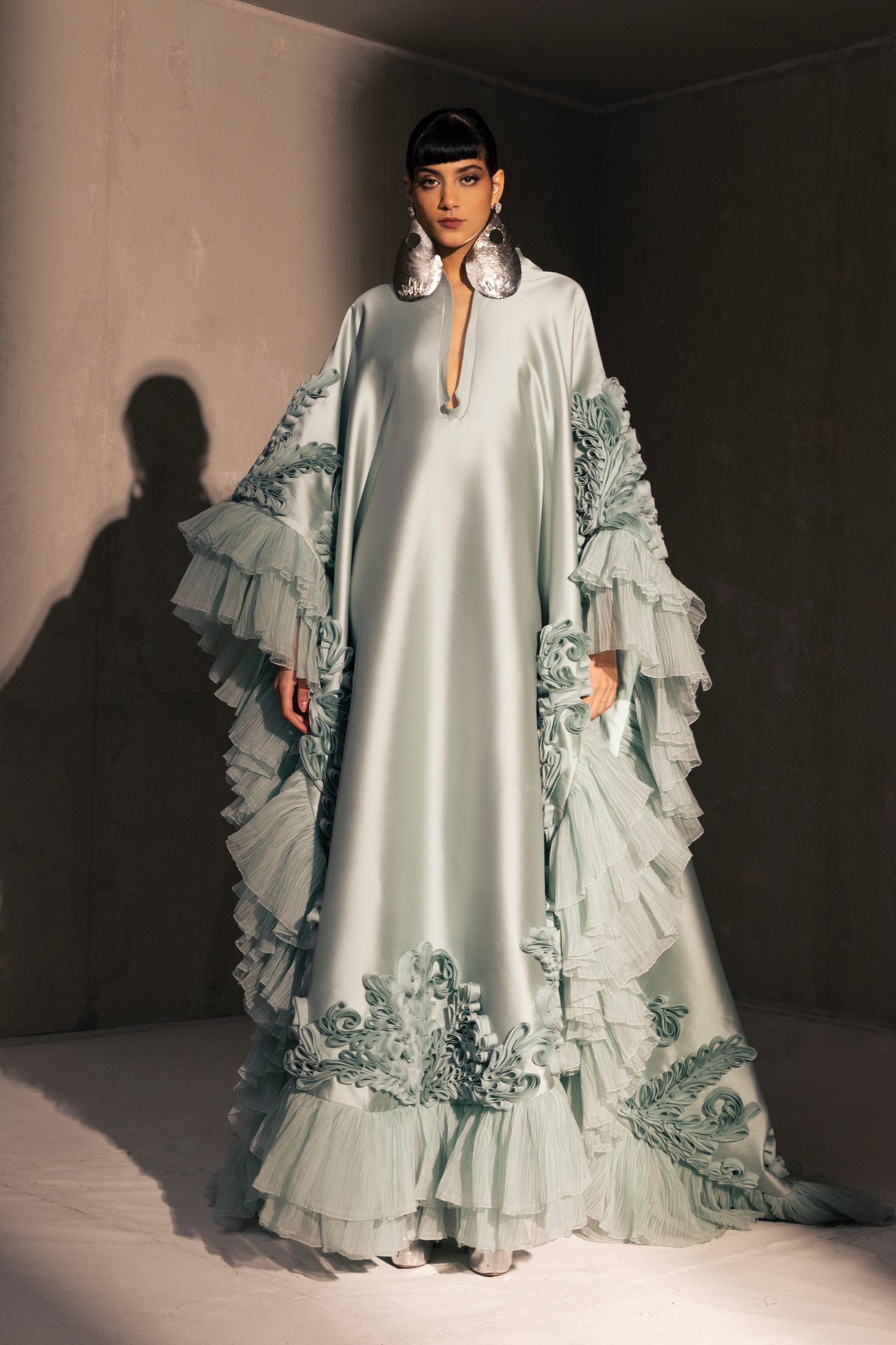 Voluminous Ruffled Cape Gown